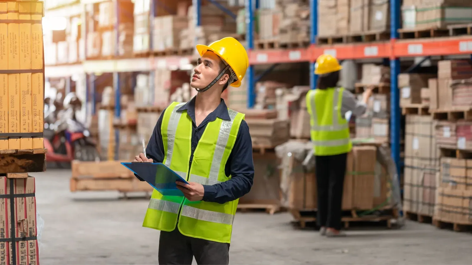 Warehouse team members coordinating inventory movement